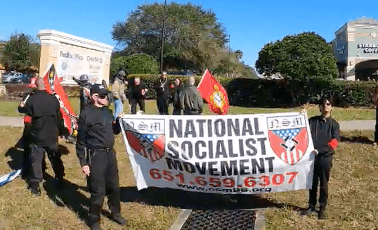 Videos Show Neo-Nazis Waving Flags, Chanting Slogans, Assaulting Driver in Florida Suburb