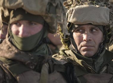 Ukrainian servicemen wait in formation before an exercise in the Joint Forces Operation, in the Donetsk region, eastern Ukraine, Tuesday, Feb. 15, 2022. While the U.S. warns that Russia could invade Ukraine any day, the drumbeat of war is all but unheard in Moscow, where pundits and ordinary people alike don't expect President Vladimir Putin to launch an attack on its ex-Soviet neighbor. (AP Photo/Vadim Ghirda)