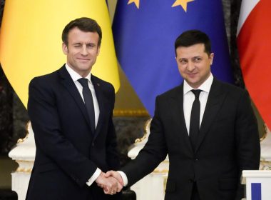 French President Emmanuel Macron, left, winks as he shakes hands with Ukrainian President Volodymyr Zelenskyy after a joint news conference following their talks in Kyiv, Ukraine, Tuesday, Feb. 8, 2022. Diplomatic efforts to defuse the tensions around Ukraine continued on Tuesday with French President Emmanuel Macron arriving in Kyiv the day after hours of talks with the Russian leader in Moscow yielded no apparent breakthroughs. (AP Photo/Efrem Lukatsky)