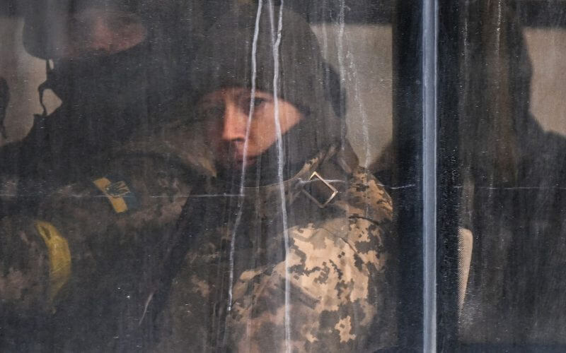 Members of Ukrainian forces looks on from a public transport bus in downtown Kyiv, on Feb. 27. Photo: Aris Messinis / AFP via Getty Images