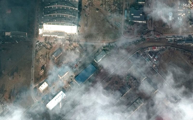 This satellite image provided by Maxar Technologies shows the aftermath of combat with grass fires and damage caused by recent airstrikes and heavy fighting with the Russians in and near the Antonov Airport, in Hostomel, Ukraine, Sunday, Feb. 27, 2022. (Satellite image ©2022 Maxar Technologies via AP)