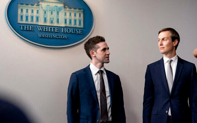 Avi Berkowitz, assistant to the president and special representative for international negotiations, left, and president Donald Trump's White House senior adviser Jared Kushner, look at each other during a press briefing in the James Brady Press Briefing Room at the White House in Washington, August 13, 2020 (AP Photo/Andrew Harnik)