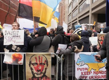 People take part in a protest against Russia's military operation in Ukraine, outside the Russian Mission to the United Nations in New York City, U.S., February 24, 2022. REUTERS/Jeenah Moon