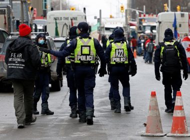 Police officers patrol downtown streets as truckers and supporters continue to protest coronavirus disease (COVID-19) vaccine mandates, in Ottawa, Ontario, Canada, February 16, 2022. REUTERS/Blair Gable