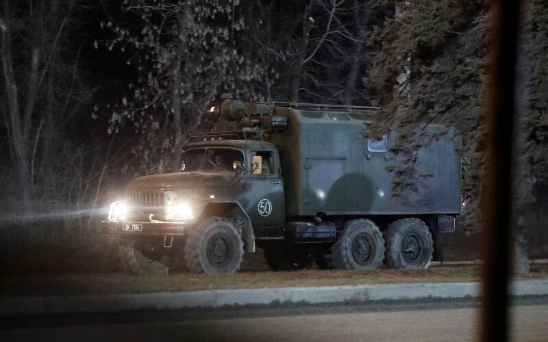 A military vehicle is seen on a street on the outskirts of the separatist-controlled city of Donetsk, Ukraine February 24, 2022. REUTERS/Alexander Ermochenko
