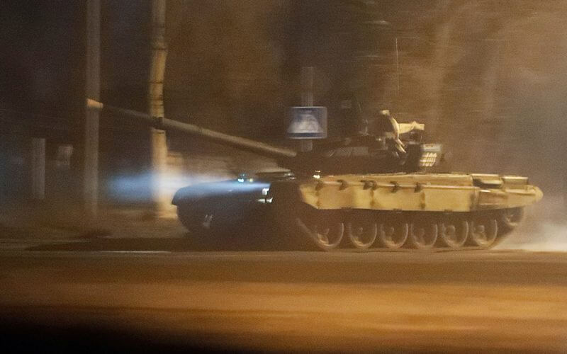 A tank travels along a street after Russian President Vladimir Putin ordered the deployment of Russian troops to two breakaway regions in eastern Ukraine following the recognition of their independence in the separatist-controlled city of Donetsk, Ukraine, Feb. 22, 2022. (REUTERS/Alexander Ermochenko)