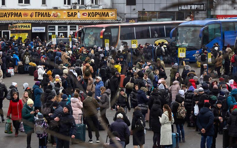 People wait for buses at a bus station as they attempt to evacuate the city Feb. 24, 2022, in Kyiv, Ukraine. Overnight, Russia began a large-scale attack on Ukraine, with explosions reported in multiple cities and far outside the restive eastern regions held by Russian-backed rebels. (Pierre Crom/Getty Images)