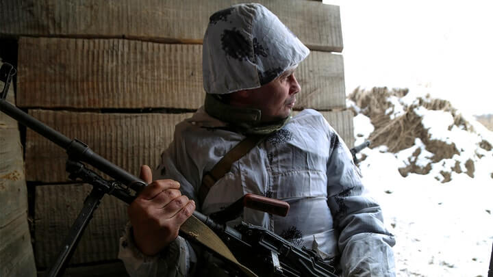 A serviceman holds his machine-gun in a shelter on the territory controlled by pro-Russian militants at frontline with Ukrainian government forces in Slavyanoserbsk, Luhansk region, eastern Ukraine, Tuesday, Jan. 25, 2022. (AP Photo/Alexei Alexandrov (AP Photo/Alexei Alexandrov / AP Newsroom)