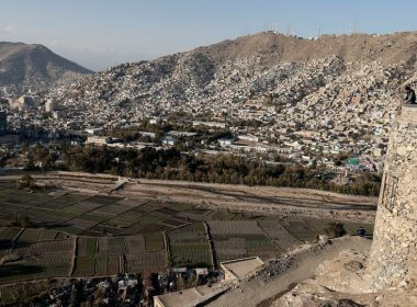 Afghan men enjoy the general view of the city from the top of a hill in Kabul, Afghanistan November 5, 2021. REUTERS/Zohra Bensemra