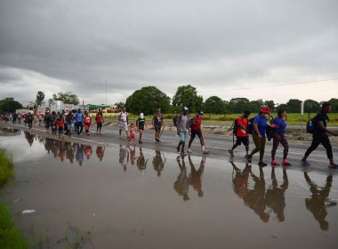 Migrants and asylum seekers from Central America and the Caribbean walk in a caravan headed to the Mexican capital to apply for asylum and refugee status, on a highway in Escuintla, in Chiapas state, Mexico August 31, 2021. REUTERS/Jacob Garcia