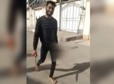 The disturbing footage shows Sajjad Heydari grinning as he carries his wife Mona Heydari’s severed head in one hand and a blade in the other. She was 17 years old.