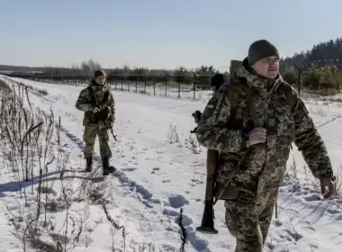 Members of the Ukrainian Border Guard patrol along the Ukrainian border fence at the Three Sisters border crossing between, Ukraine, Russia and Belarus on February 14, 2022 in Senkivka, Ukraine. Russia said on Tuesday that is pulling back some of its troops from near the border with Ukraine, but Kyiv called its bluff, asking to see evidence that it has withdrawn the soldiers. CHRIS MCGRATH/GETTY