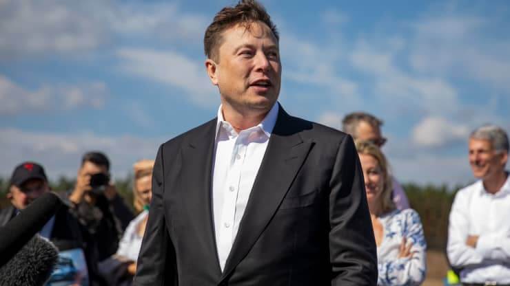 Tesla head Elon Musk talks to the press as he arrives to have a look at the construction site of the new Tesla Gigafactory near Berlin on September 03, 2020 near Gruenheide, Germany. Maja Hitij | Getty Images