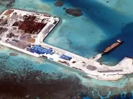 An aerial view from 2015 of Chinese development on Kennan Reef in the disputed Spratly Islands, currently controlled by China and claimed by the Philippines as part of Palawan. Photo: History/Universal Images Group via Getty Images