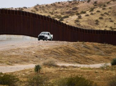A US Border Patrol vehicle sits next to a border wall in the El Paso Sector along the US-Mexico border between New Mexico and Chihuahua state on December 9, 2021 in Sunland Park, New Mexico. (Photo by Patrick T. FALLON / AFP) (Photo by PATRICK T. FALLON/AFP via Getty Images)