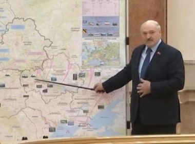 Belarussian President Alexander Lukashenko standing in front of a battle map that appears to show a planned invasion of Moldova (Yahoo)