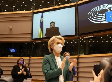 European Commission President Ursula von der Leyen applauds after an address by Ukraine's President Volodymyr Zelenskyy, via video link, at the European Parliament in Brussels, Tuesday, March 1, 2022. (AP Photo/Virginia Mayo)