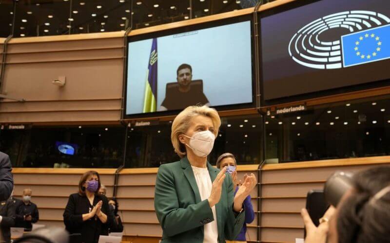 European Commission President Ursula von der Leyen applauds after an address by Ukraine's President Volodymyr Zelenskyy, via video link, at the European Parliament in Brussels, Tuesday, March 1, 2022. (AP Photo/Virginia Mayo)