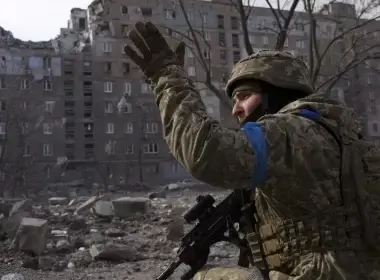 A Ukrainian service member guards his position in Mariupol, Ukraine, Saturday, March 12, 2022. (Associated Press)