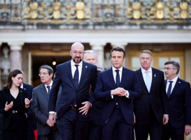 French President Emmanuel Macron, European Council President Charles Michel and EU leaders arrive for a family photo during an informal summit at the Chateau de Versailles (Versailles Palace), amid Russia's invasion of Ukraine, in Versailles, near Paris, France, March 10, 2022. REUTERS/Sarah Meyssonnier