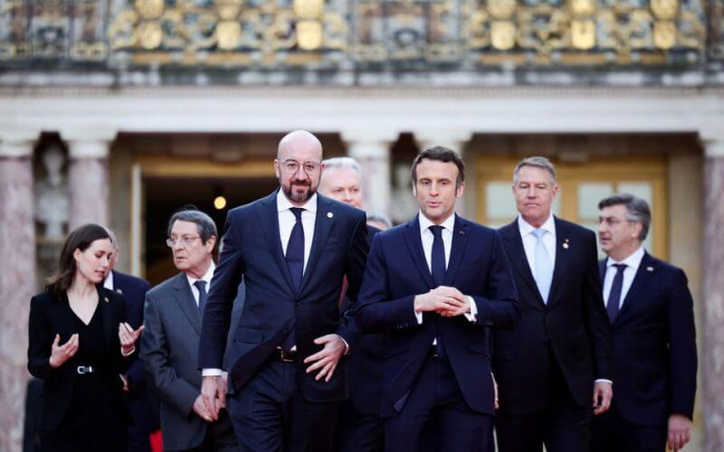 French President Emmanuel Macron, European Council President Charles Michel and EU leaders arrive for a family photo during an informal summit at the Chateau de Versailles (Versailles Palace), amid Russia's invasion of Ukraine, in Versailles, near Paris, France, March 10, 2022. REUTERS/Sarah Meyssonnier