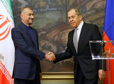 Russian Foreign Minister Sergei Lavrov shakes hands with Iranian Foreign Minister Hossein Amir-Abdollahian during a joint news conference in Moscow, Russia March 15, 2022. REUTERS/Maxim Shemetov/Pool