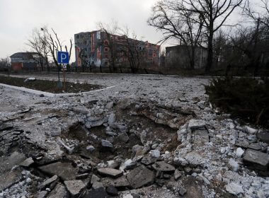 A shell crater is seen in the street during Ukraine-Russia conflict in the besieged southern port of Mariupol, Ukraine March 27, 2022. REUTERS/Alexander Ermochenko