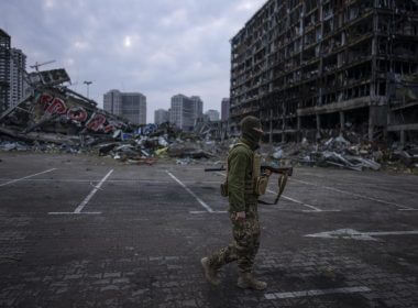 A soldier walks the amid the destruction caused after shelling of a shopping center last March 21 in Kyiv, Ukraine, Wednesday, March 30, 2022. (AP Photo/Rodrigo Abd)