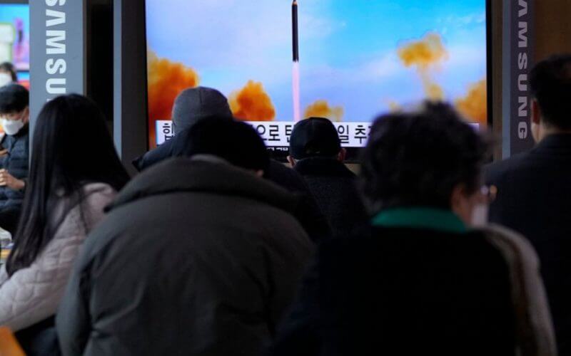 People watch a TV showing a file image of North Korea's missile launch during a news program at the Seoul Railway Station in Seoul, South Korea, Saturday, March 5, 2022. North Korea on Saturday fired a suspected ballistic missile into the sea, according to its neighbors' militaries, apparently extending its streak of weapons tests this year amid a prolonged freeze in nuclear negotiations with the United States. (AP Photo /Ahn Young-joon)