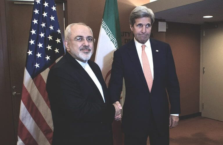 Former Iranian foreign minister Mohammad Javad Zarif and John Kerry (Don Emmert/AFP via Getty Images)