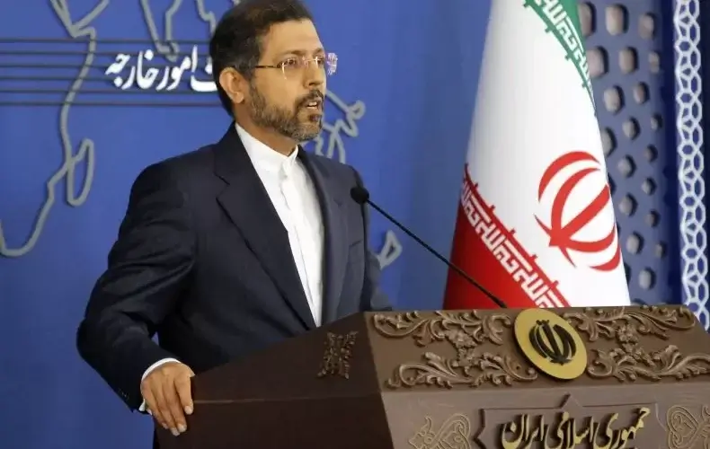 Iranian officials said on Monday that they're working with the United States to negotiate a potential prisoner exchange in tandem with a nuclear deal. Above, Iranian Foreign Ministry spokesman Saeed Khatibzadeh speaks to media during a press conference in Tehran on November 15, 2021. GETTY IMAGES/AFP
