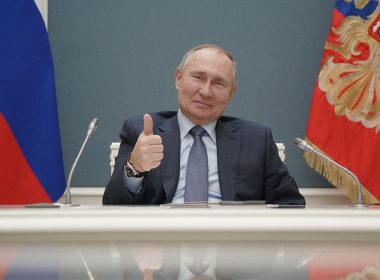 Russian President Vladimir Putin gives a thumbs-up as he attends a foundation-laying ceremony for the third reactor of the Akkuyu nuclear plant in Turkey March 10, 2021. (Sputnik/Alexei Druzhinin/Kremlin via REUTERS/File Photo)