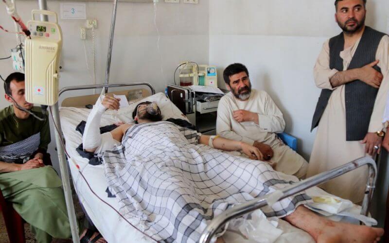 An Afghan man receives treatment in a hospital after he was injured in an explosion at a Shi'ite mosque in Mazar-e-Sharif, Afghanistan, April 21, 2022. REUTERS/Stringer