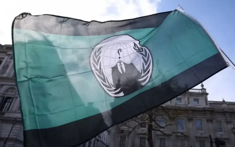 Anonymous appeared to claim responsibility on Sunday for personal information of 120,000 Russian soldiers fighting in Ukraine being leaked last month. Above, the group’s flag is seen in London on Saturday. HOLLIE ADAMS/GETTY IMAGES