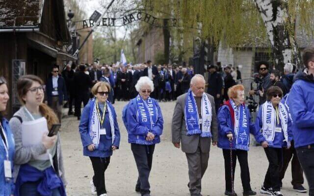 Holocaust survivors take part in The March of the Living in honor of the victims of the Holocaust, at the site of the Memorial and Museum Auschwitz-Birkenau in Oswiecim, Poland, on April 28, 2022. (Wojtek Radwanski/AFP)