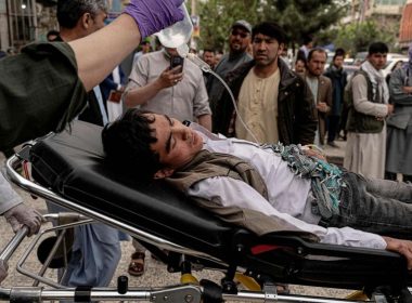 Medical staff move a wounded youth by stretcher outside a hospital in Kabul, April 19, 2022, after two bomb blasts rocked a boys' school in a Shiite Hazara neighborhood killing several. Wakil Kohsar/AFP via Getty Images