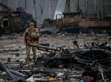 A Ukrainian service member inspects a compound of the Antonov airfield, as Russia's attack on Ukraine continues, in the settlement of Hostomel, in Kyiv region, Ukraine April 3, 2022. REUTERS/Gleb Garanich