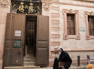 People walk outside the Alexander Nevsky Church in Jerusalem's Old City, on January 20, 2020. (Olivier Fitoussi/Flash90)