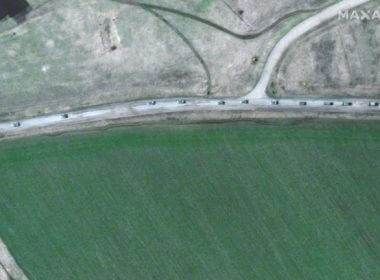 A handout satellite image made available by Maxar Technologies shows a convoy of armored military vehicles and trucks that extends for at least eight miles moving south through the Ukrainian town of Velykyi Burluk on Friday. Photo courtesy Maxar Technologies