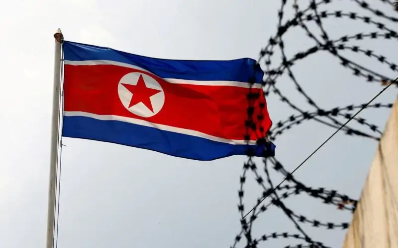A North Korea flag flutters next to concertina wire at the North Korean embassy in Kuala Lumpur, Malaysia March 9, 2017. REUTERS