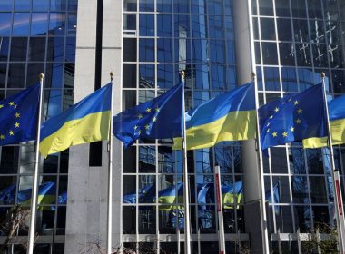 The flags of the European Union and Ukraine flutter outside the European Parliament building, in Brussels, Belgium, February 28, 2022. REUTERS/Yves Herman/File Photo