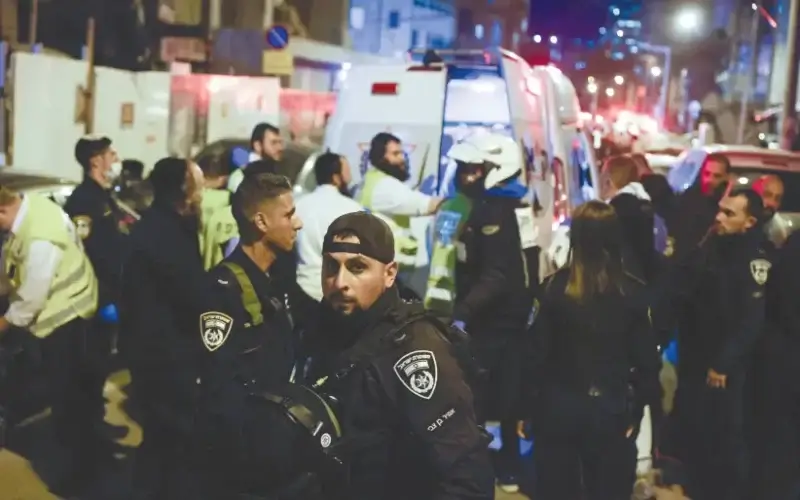 POLICE OFFICERS and rescue forces are seen at the scene of Tuesday night’s terror attack in Bnei Brak. (credit: OLIVIER FITOUSSI/FLASH90)