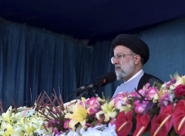 Iran's President Ebrahim Raisi reviews the army troops parade commemorating National Army Day in front of the mausoleum of the late revolutionary founder Ayatollah Khomeini, outside Tehran, Iran, April 18, 2022. (Iranian Presidency Office via AP)