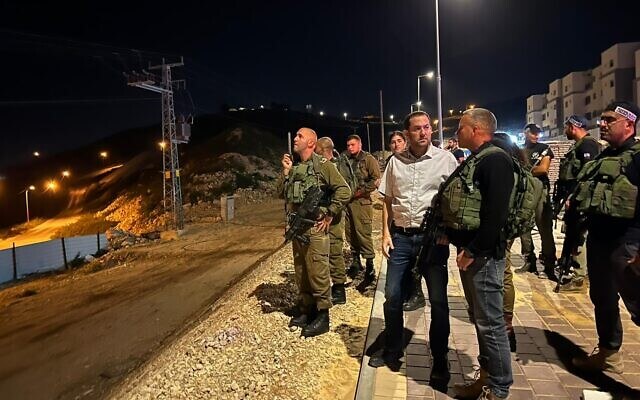Samaria Regional Council head Yossi Dagan, alongside military and local security forces in the settlement of Avnei Hefetz in the northern West Bank, April 5, 2022. (Samaria Regional Council )