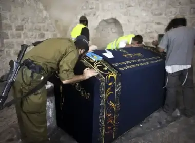 An Israeli soldier prays together with other worshippers inside Joseph's Tomb in the West Bank (photo credit: NIR ELIAS / REUTERS)