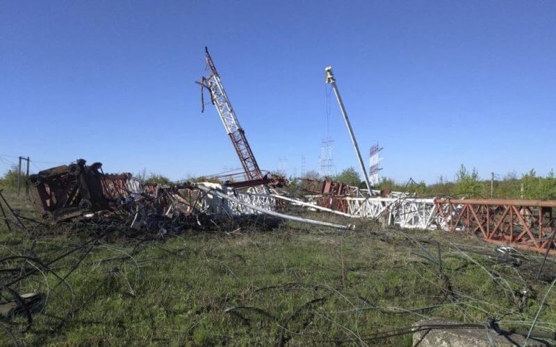 In this photograph released by the Press Center of the Ministry of Internal Affairs of the Pridnestrovian Moldavian Republic, destroyed radio antennas lie on the ground in Maiac, in the Moldovan separatist region of Trans-Dniester, Tuesday, April 26, 2022. Police in the Moldovan separatist region of Trans-Dniester say two explosions on Tuesday morning in a radio facility close to the Ukrainian border knocked two powerful antennas out of service just a day after several explosions believed to be caused by rocket-propelled grenades were reported to have hit the Ministry of State Security in the city of Tiraspol, the region's capital (Press Center of the Ministry of Internal Affairs of the Pridnestrovian Moldavian Republic via AP, HO)