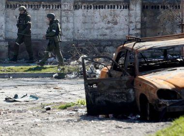 Service members of pro-Russian troops inspect streets during Ukraine-Russia conflict in the southern port city of Mariupol, Ukraine April 7, 2022. REUTERS/Alexander Ermochenko