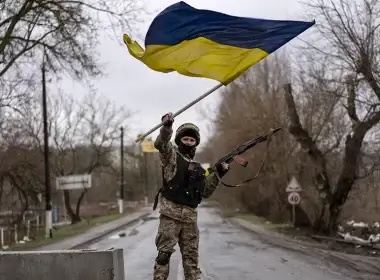 A Ukrainian soldier celebrates in a check point in Bucha, in the outskirts of Kyiv, Ukraine, on Saturday, April 2, 2022. Associated Press/Rodrigo Abd