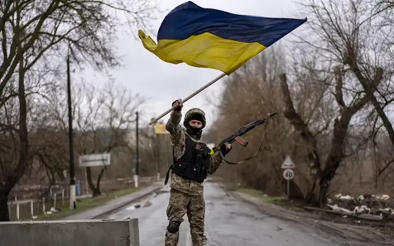 A Ukrainian soldier celebrates in a check point in Bucha, in the outskirts of Kyiv, Ukraine, on Saturday, April 2, 2022. Associated Press/Rodrigo Abd