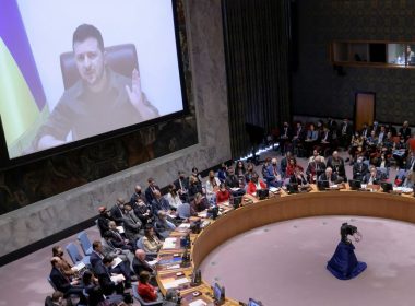 Ukrainian President Volodymyr Zelenskiy appears on a screen as he addresses the United Nations Security Council via video link during a meeting amid Russia's invasion of Ukraine, at the United Nations Headquarters in Manhattan, New York City, New York, U.S., April 5, 2022. REUTERS/Andrew Kelly